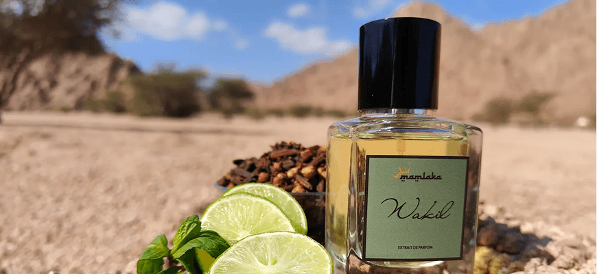 Mamlaka Wakil perfume bottle in a desert landscape with lime, mint, and cloves